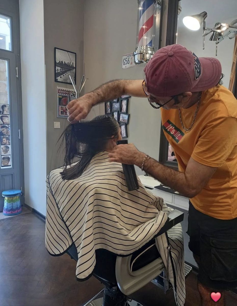 Barber at work styling a client's hair