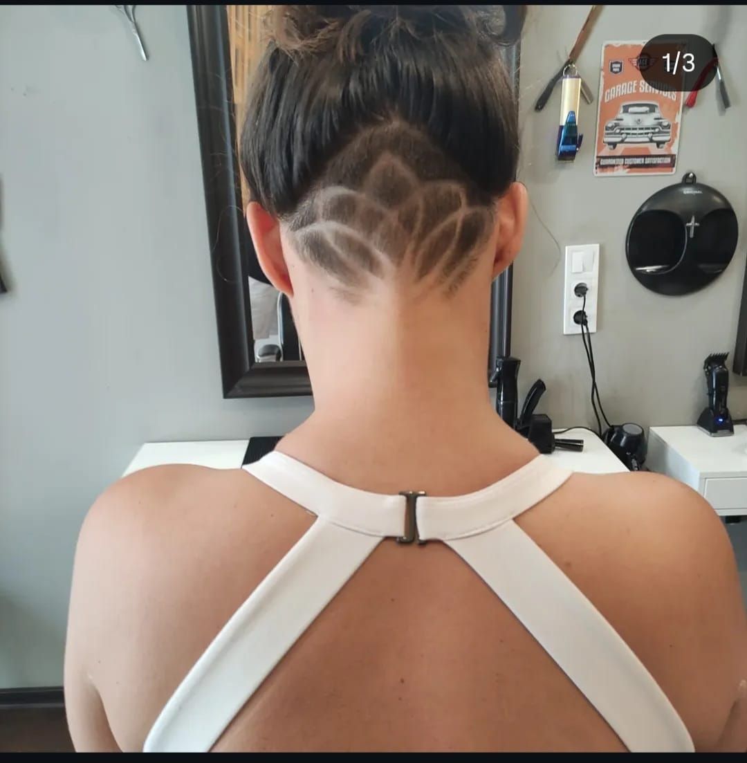 Top-knot with a lotus-pattern shaved design fade