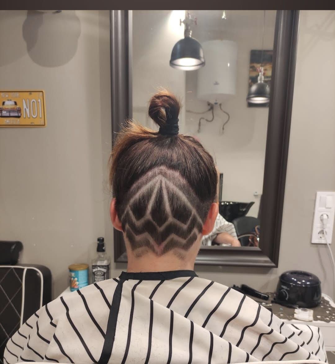 Top-knot with a diamond shaved pattern fade