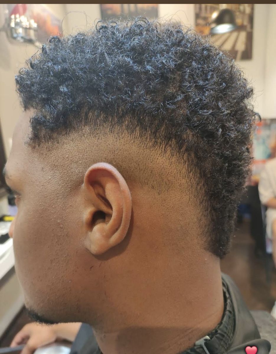 Curly hair with a clean fade