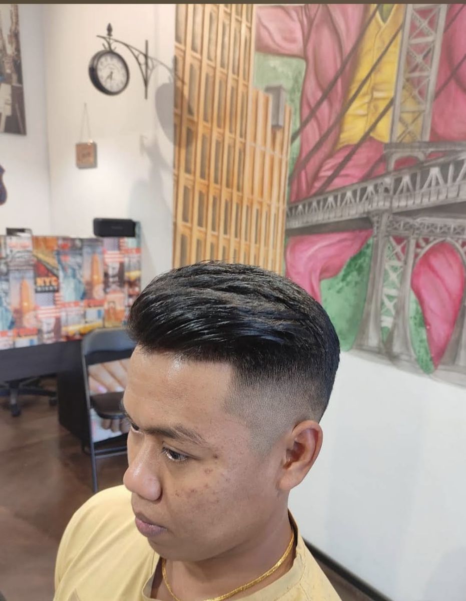 Dark hair pompadour with fade