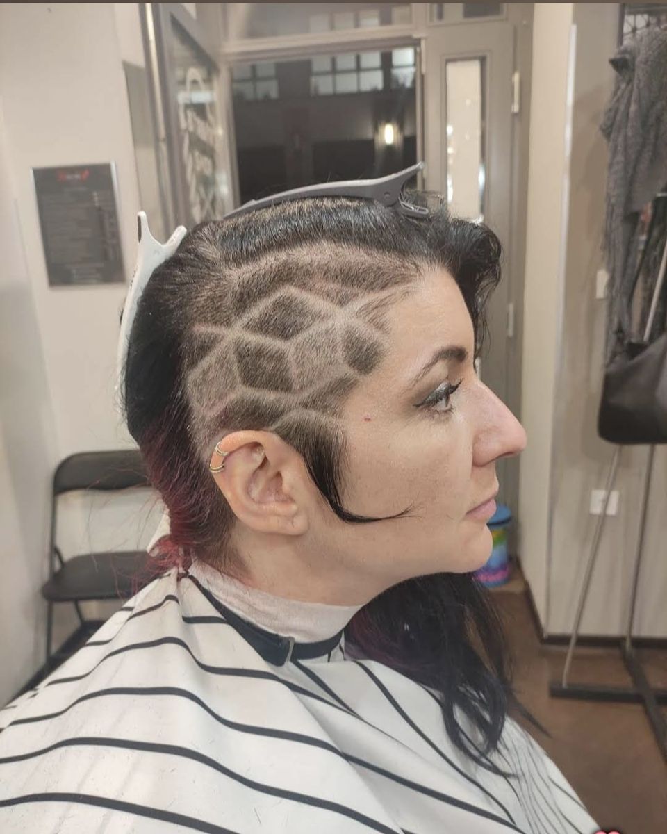 Diamond-pattern shaved design on long hair