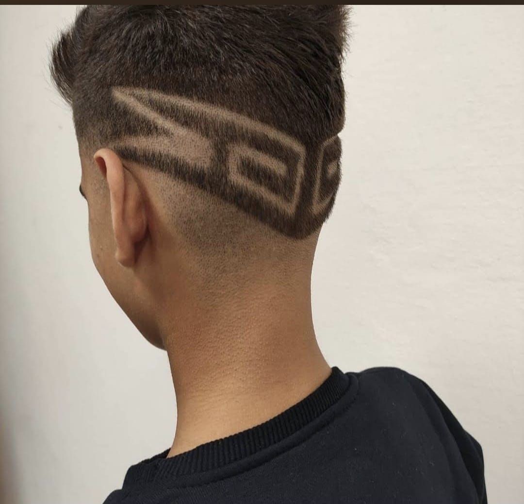 Kids' fade with a geometric shaved design on the back