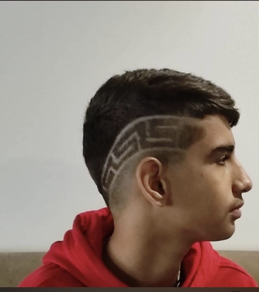 Fade with a geometric maze-pattern shaved design