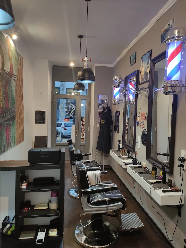 The New York Hair Salon storefront sign and barber pole on Wesselényi utca, Budapest